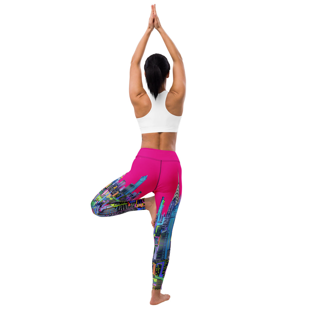 Person wearing Loria NYC Art colorful leggings and a white sports bra, standing in a yoga pose on a white background