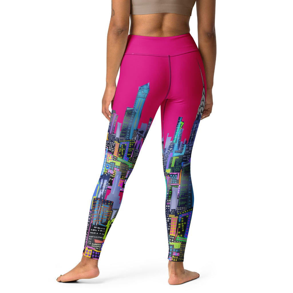 Person wearing pink leggings with a colorful cityscape Loria NYC Art design on a white background