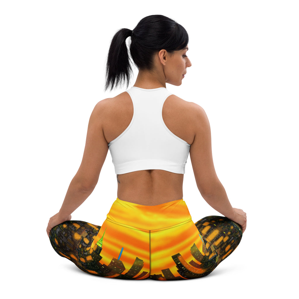 Woman wearing colorful Loria NYC Art yoga pants with a white background