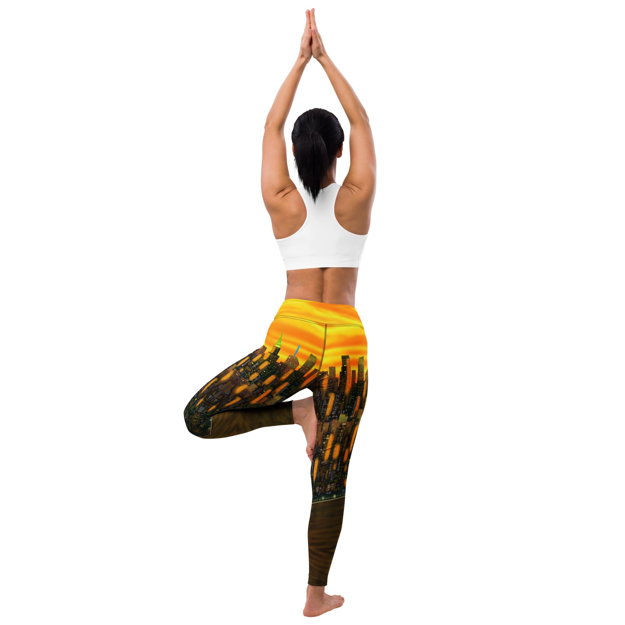 Person wearing a colorful Loria NYC Art yoga pants with a cityscape design on a white background