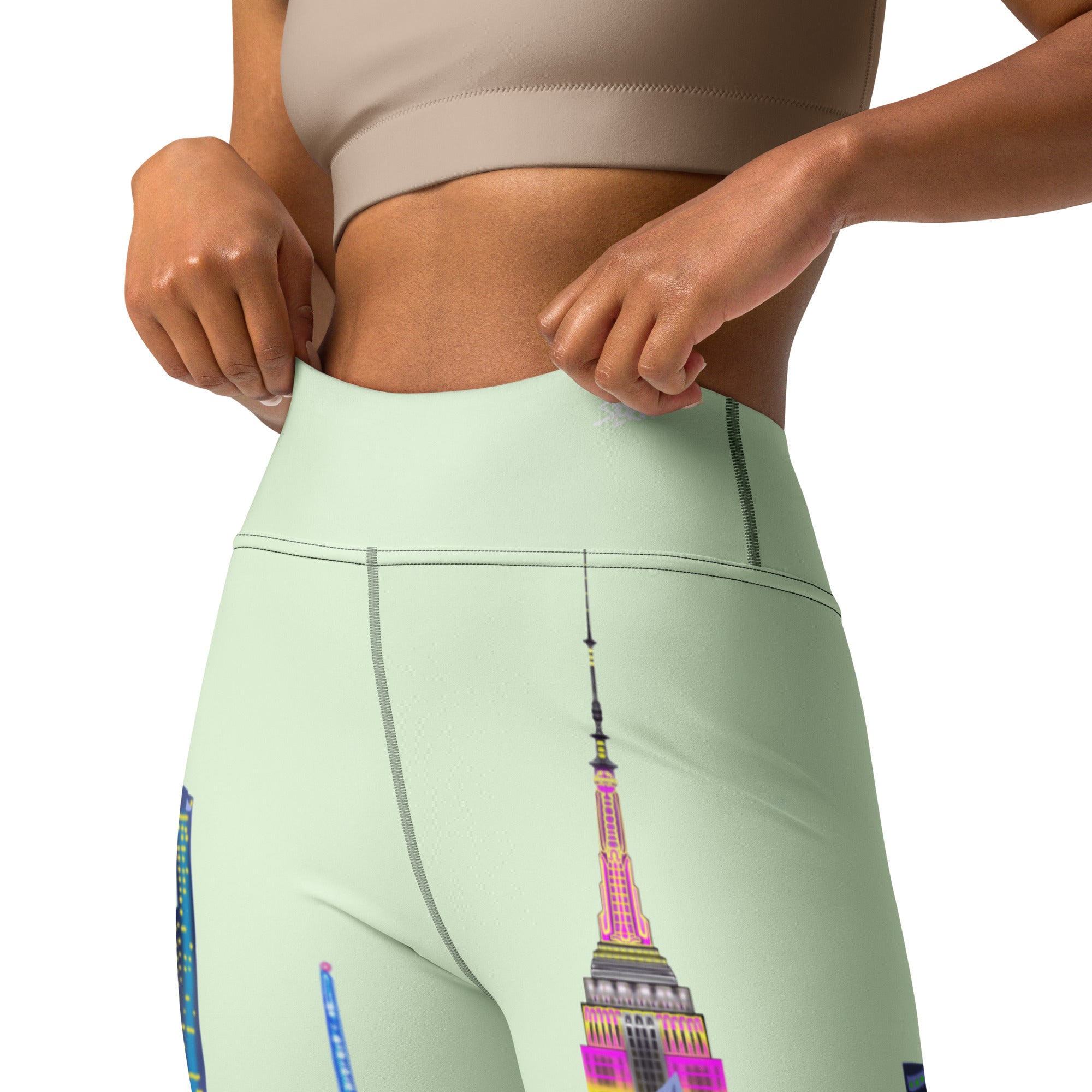 Light green leggings with a colorful NYC Art  design on a white background
