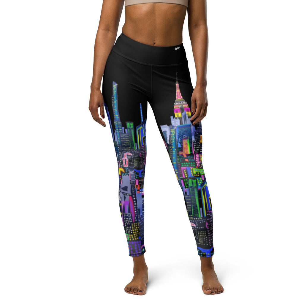 Black leggings with colorful Loria NYC Art cityscape design worn by a person on a white background