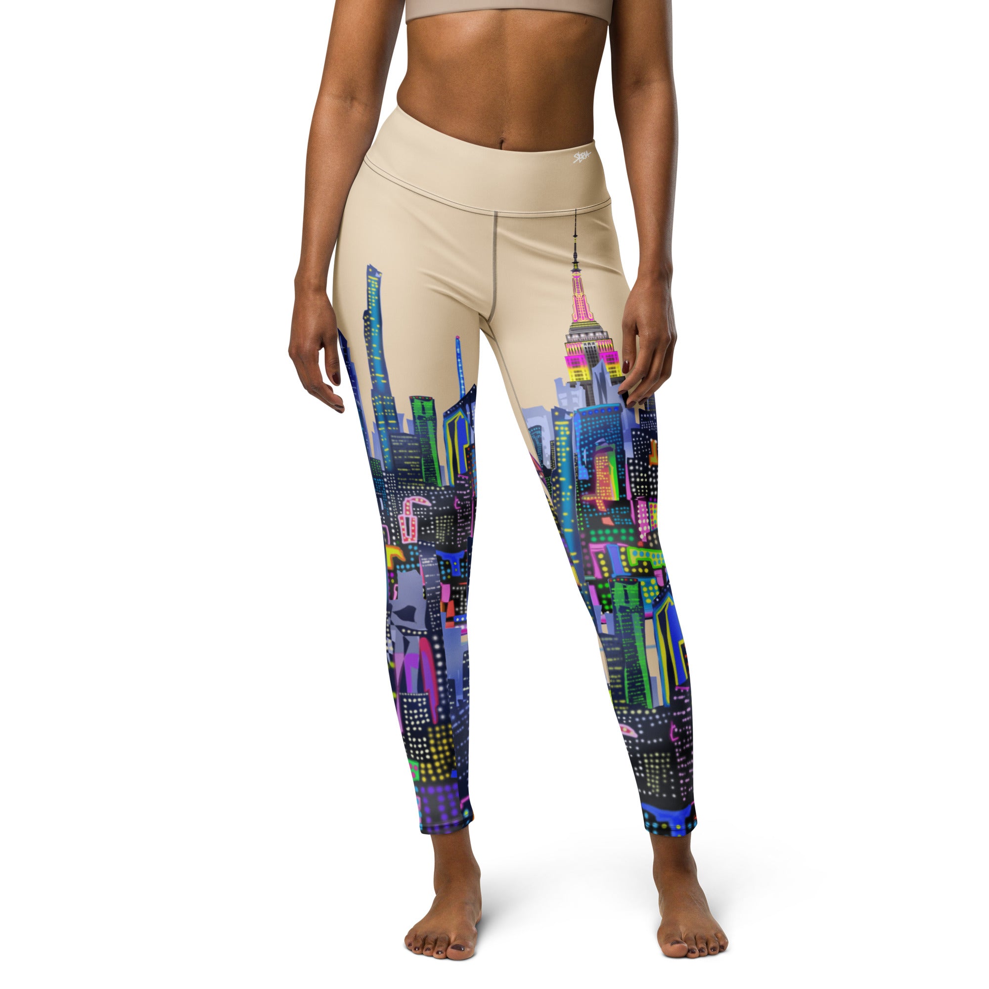 Leggings with colorful cityscape Loria NYC Art design worn by a person on a white background