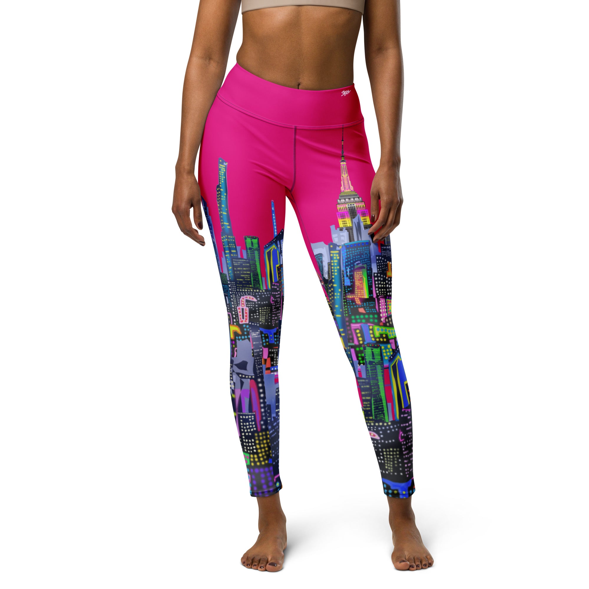 Person wearing pink leggings with cityscape Loria NYC Art design on a white background