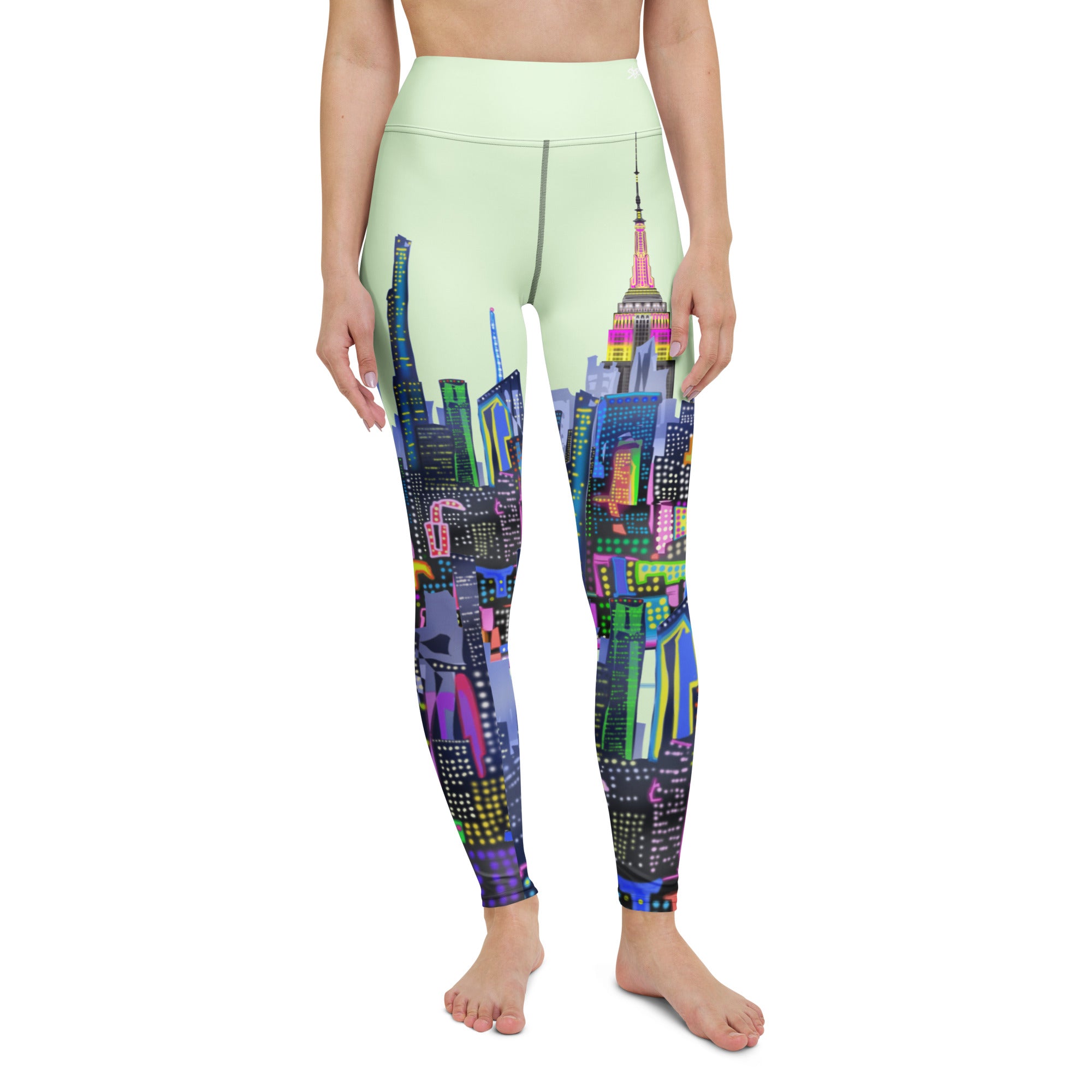 Leggings with colorful cityscape Loria NYC Art design worn by a person on a white background