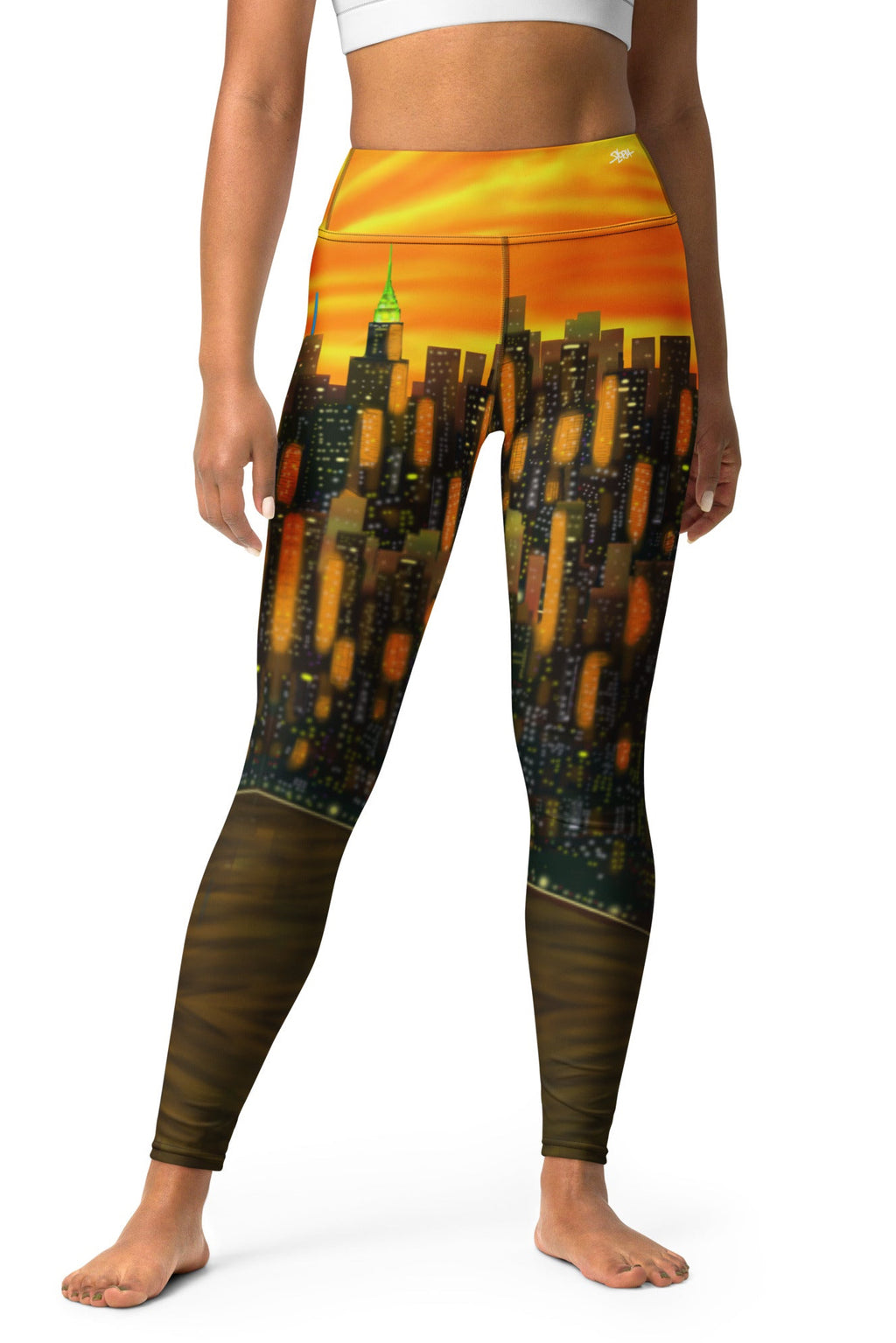 Leggings with a Loria NYC Art cityscape design worn by a person on a white background
