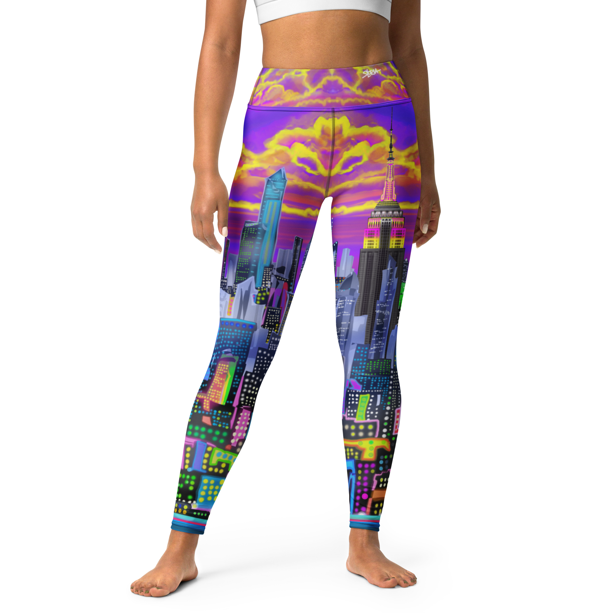 Colorful cityscape Loria NYC Art leggings worn by a person on a white background