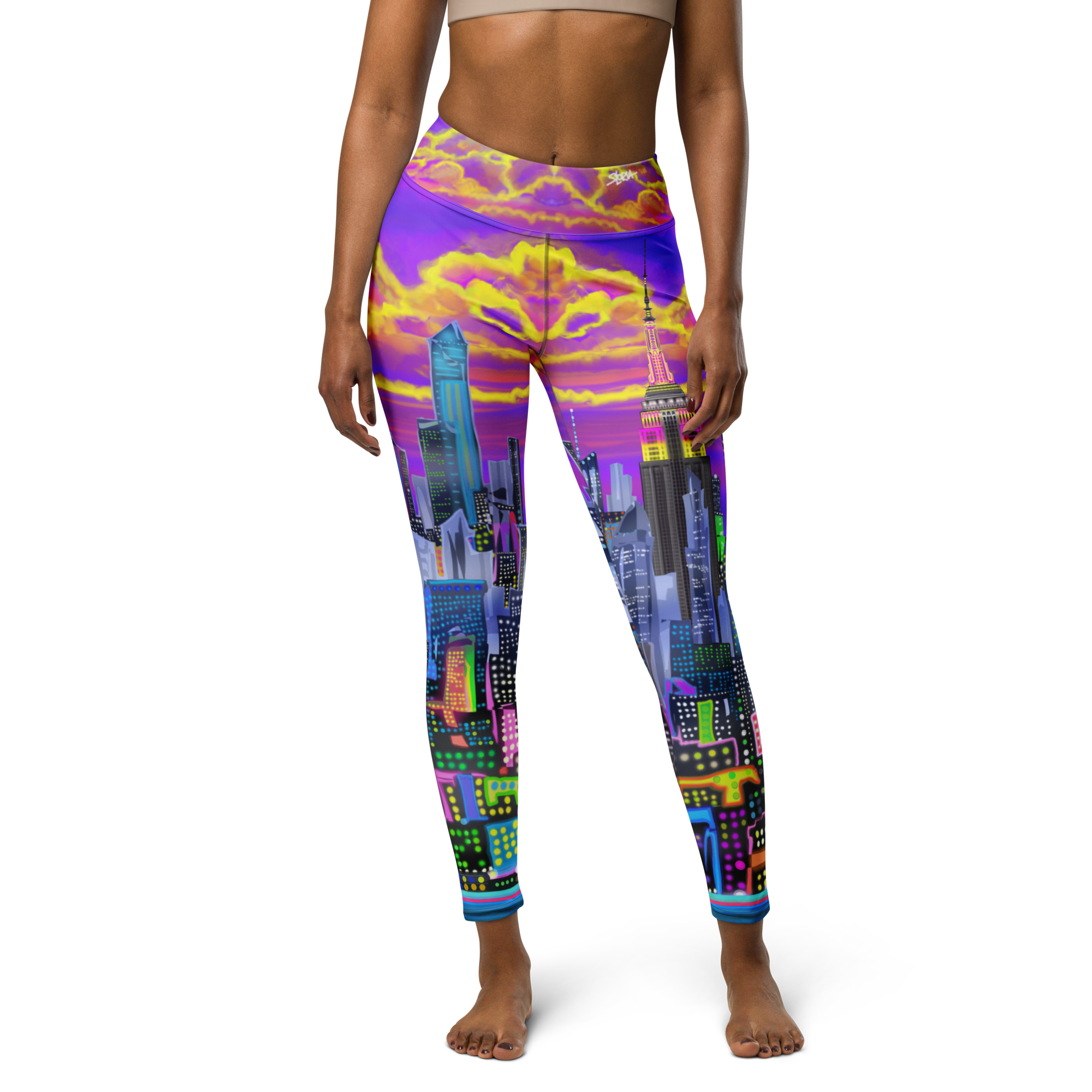 Colorful cityscape Loria NYC Art leggings worn by a person on a white background