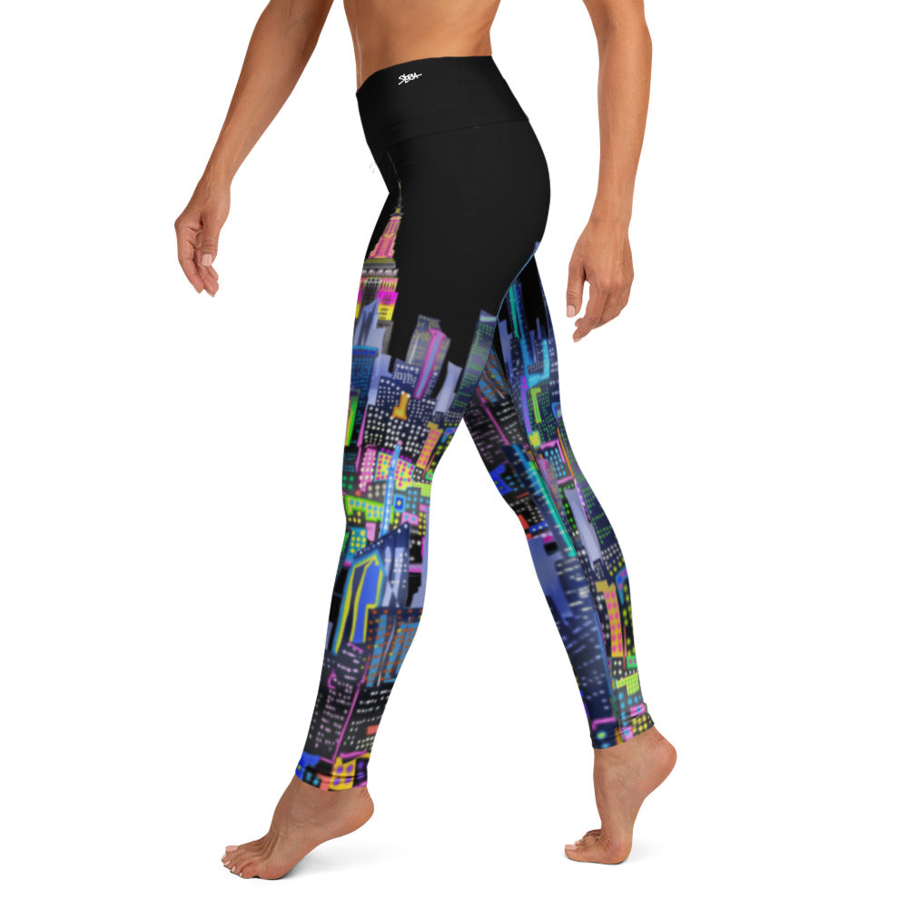Colorful cityscape Loria NYC Art leggings worn by a person on a white background