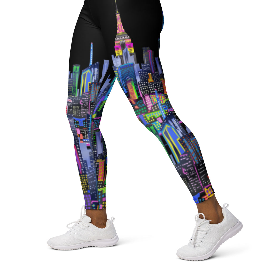 Leggings with a colorful cityscape Loria NYC Art design worn by a person on a white background
