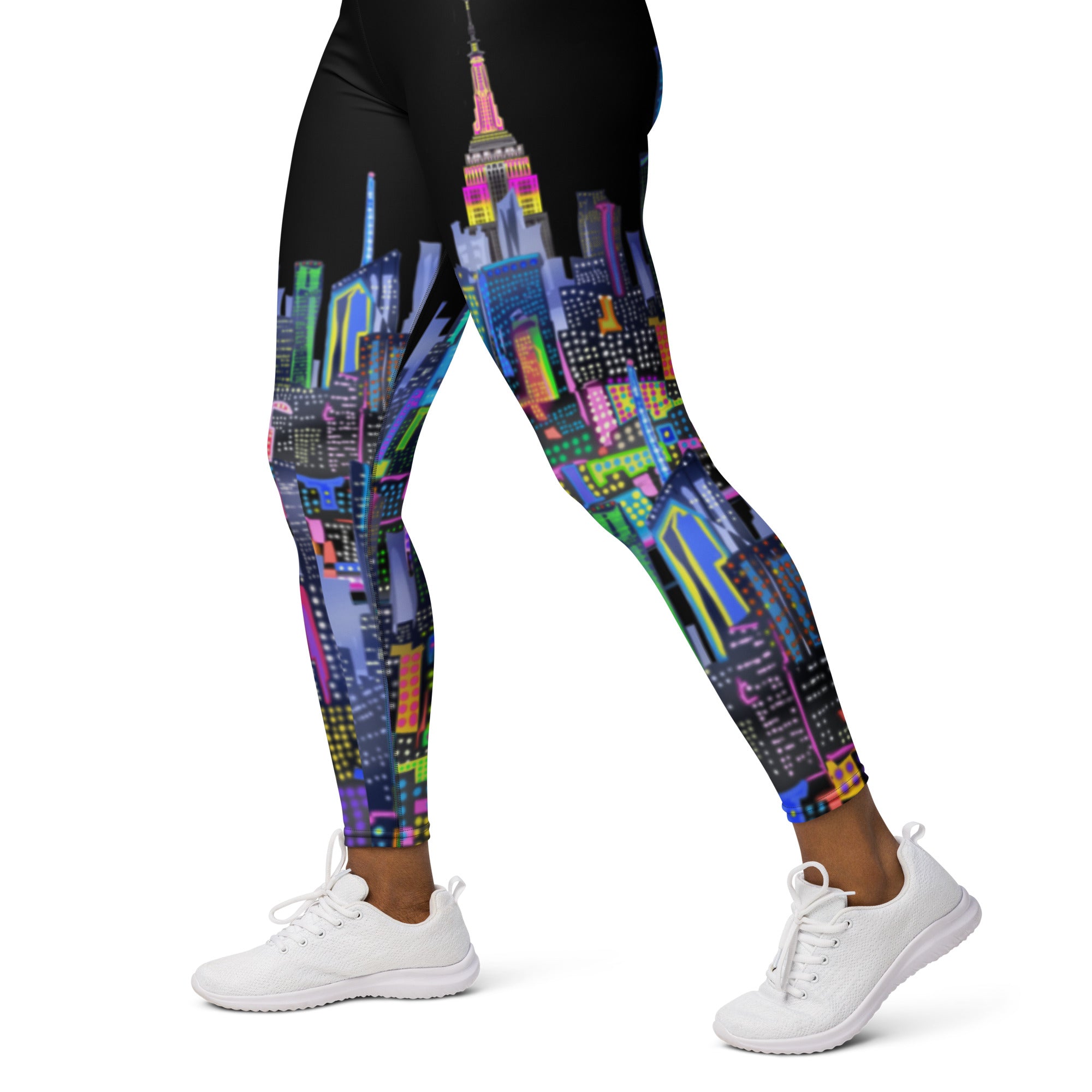 Leggings with a colorful cityscape Loria NYC Art design worn by a person on a white background