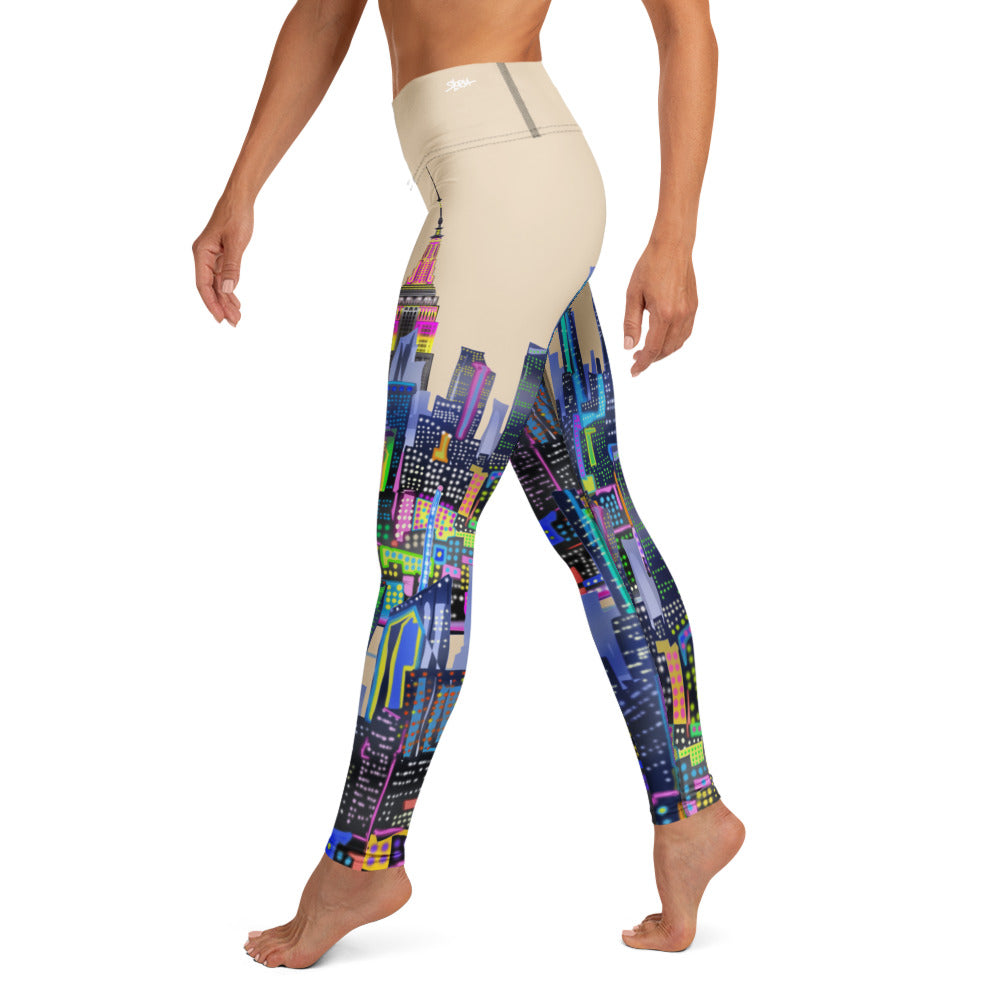 Colorful Loria NYC Art patterned leggings worn by a person on a white background