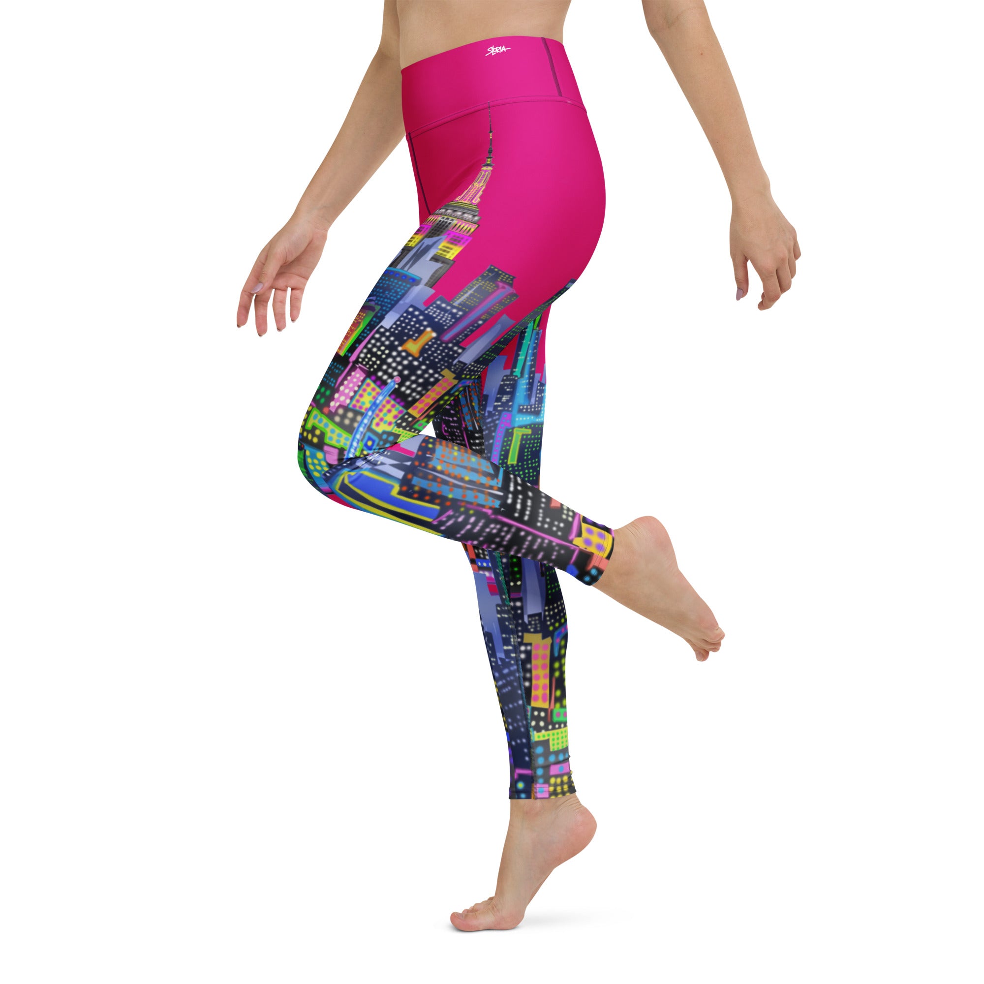Colorful Loria NYC Art cityscape leggings with a pink fuchsia waistband on a white background