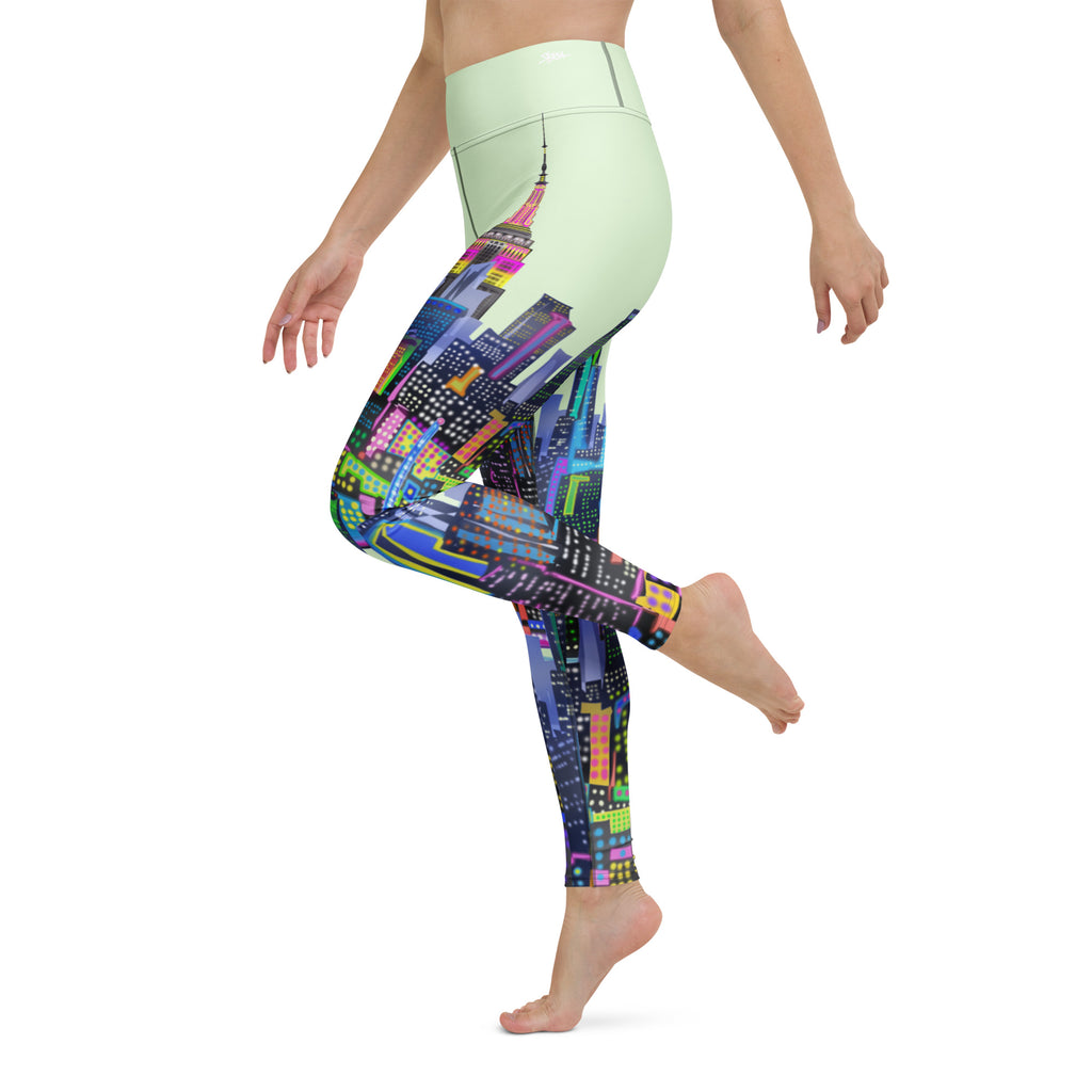 Colorful Loria NYC Art cityscape green leggings worn by a person on a white background