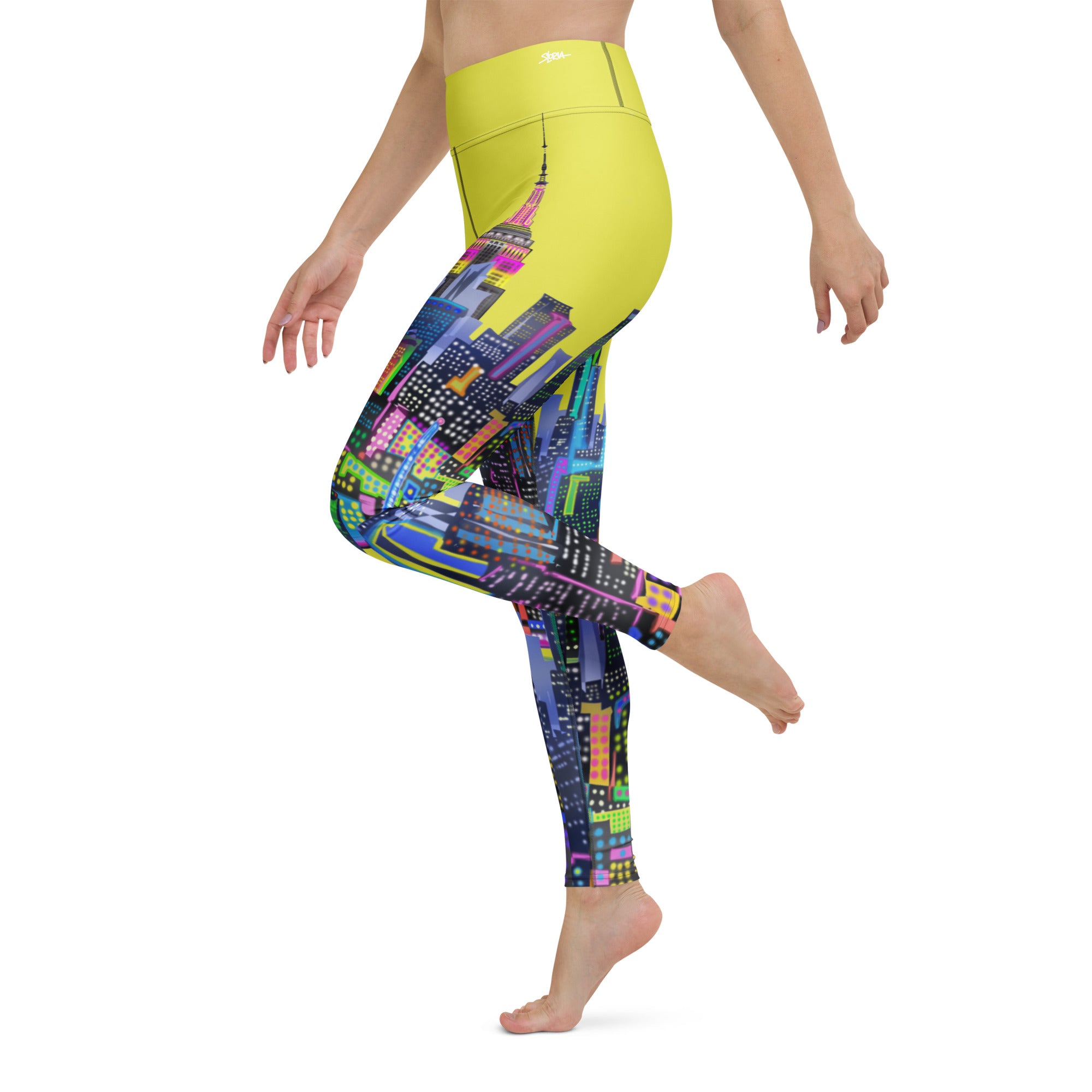 Side of Colorful  Loria NYC Art cityscape leggings worn by a person on a white background