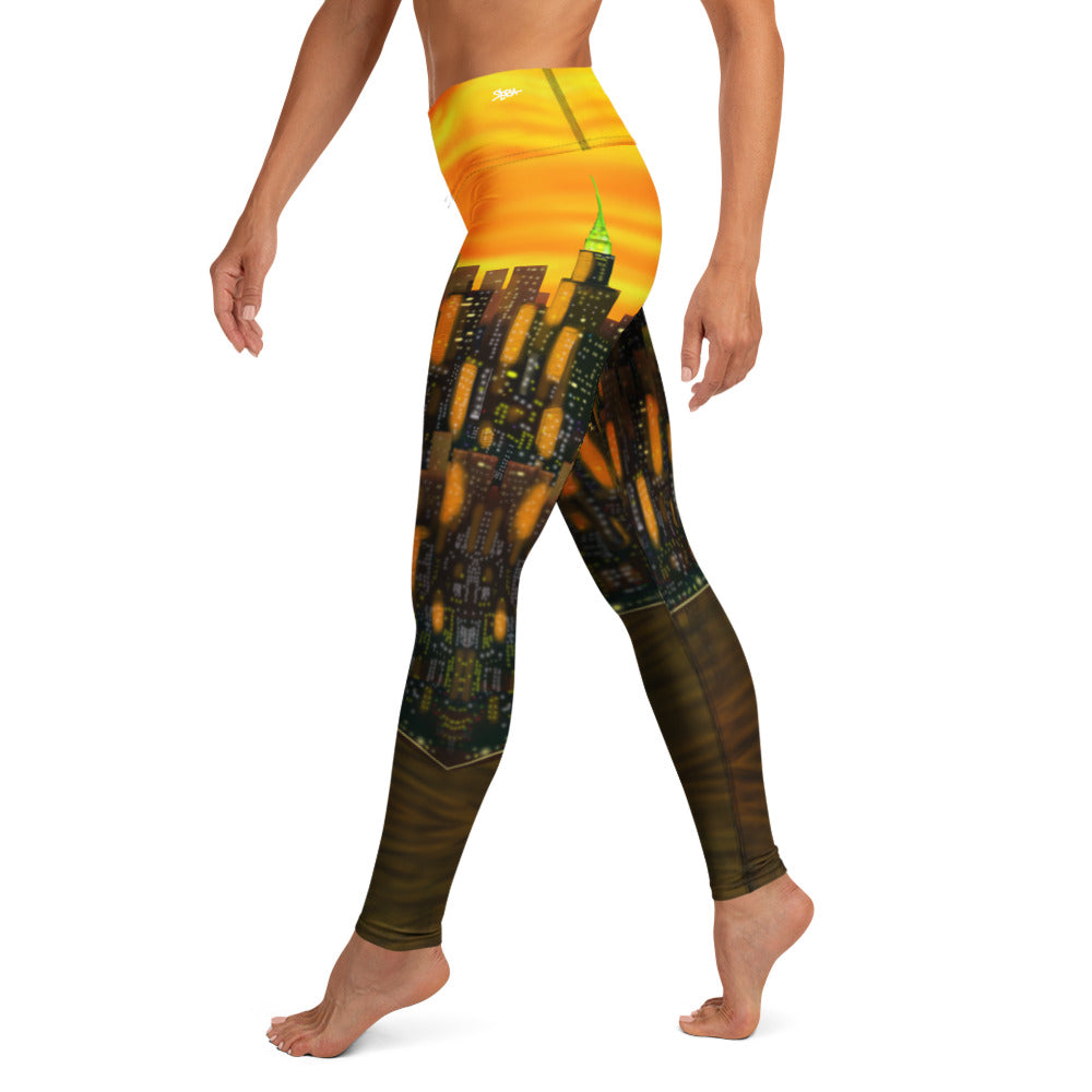 Loria NYC Art Orange Leggings with a cityscape design on a white background