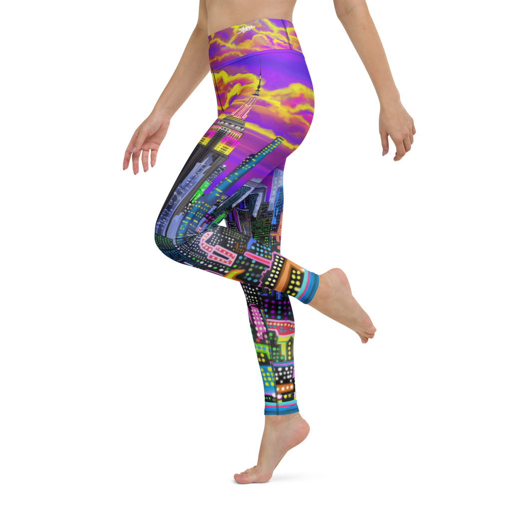 Multicolored Loria NYC Art leggings worn by a person on a white background