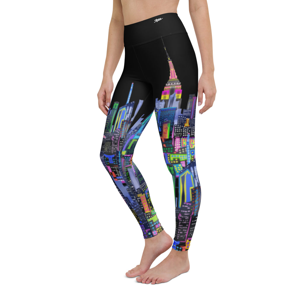 Leggings with colorful  Loria NYC Art cityscape design worn by a person on a white background