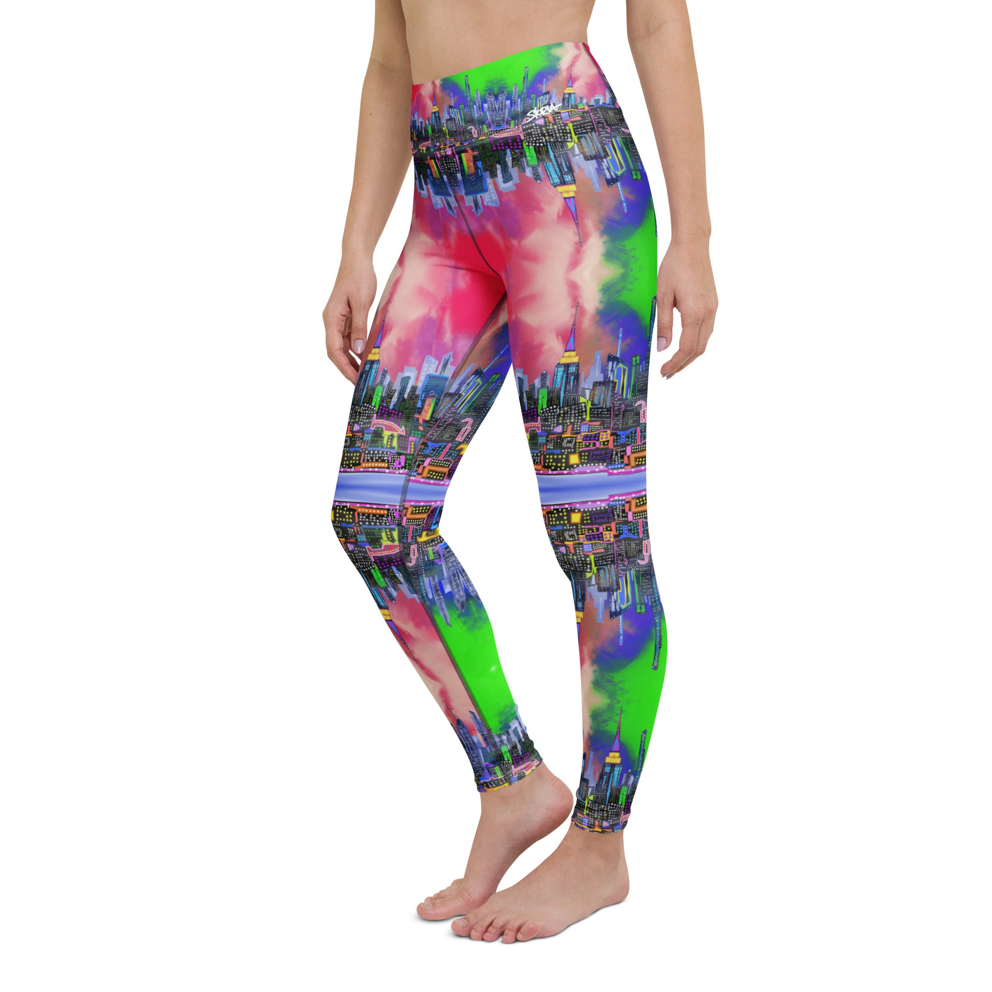 Multicolored tie-dye leggings designed by Loria NYC Art and worn by a person on a  white background