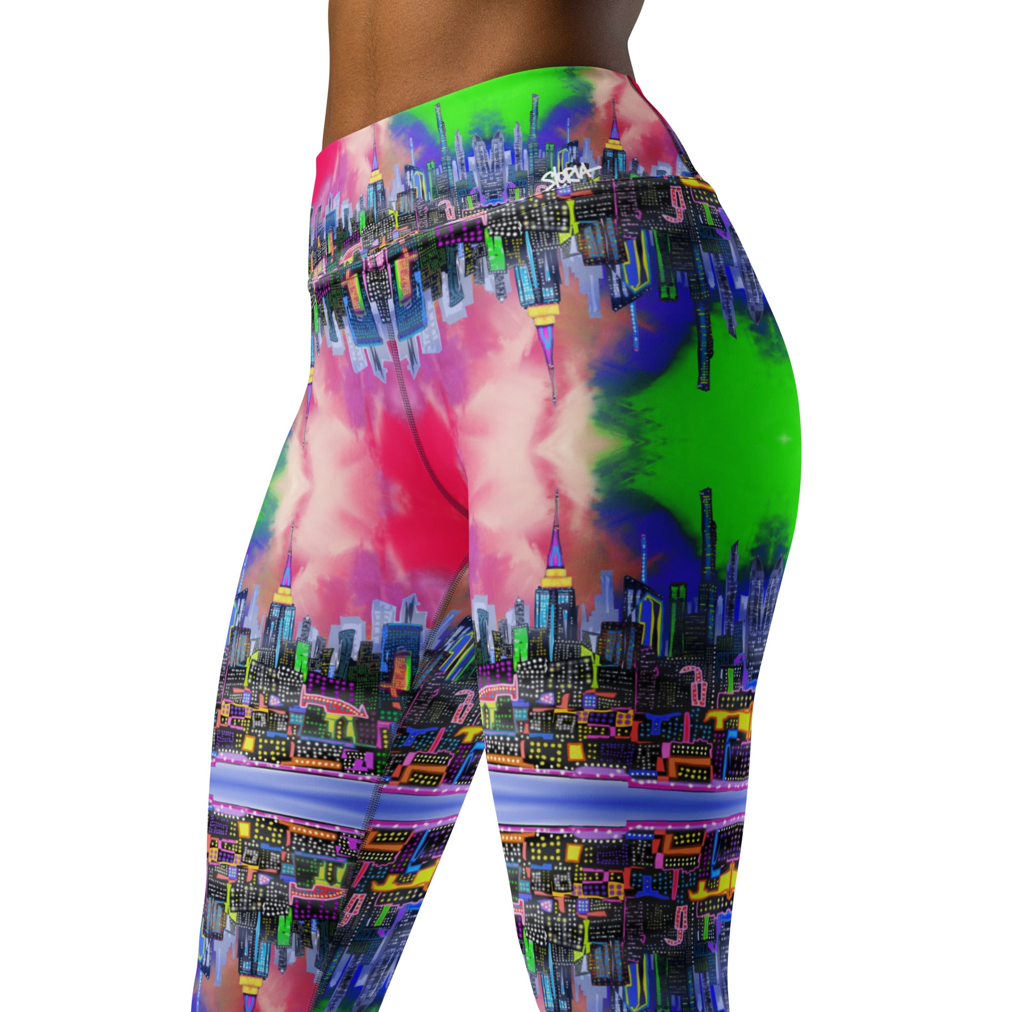 Multicolored tie-dye leggings designed by Loria NYC Art and worn by a person on a  white background