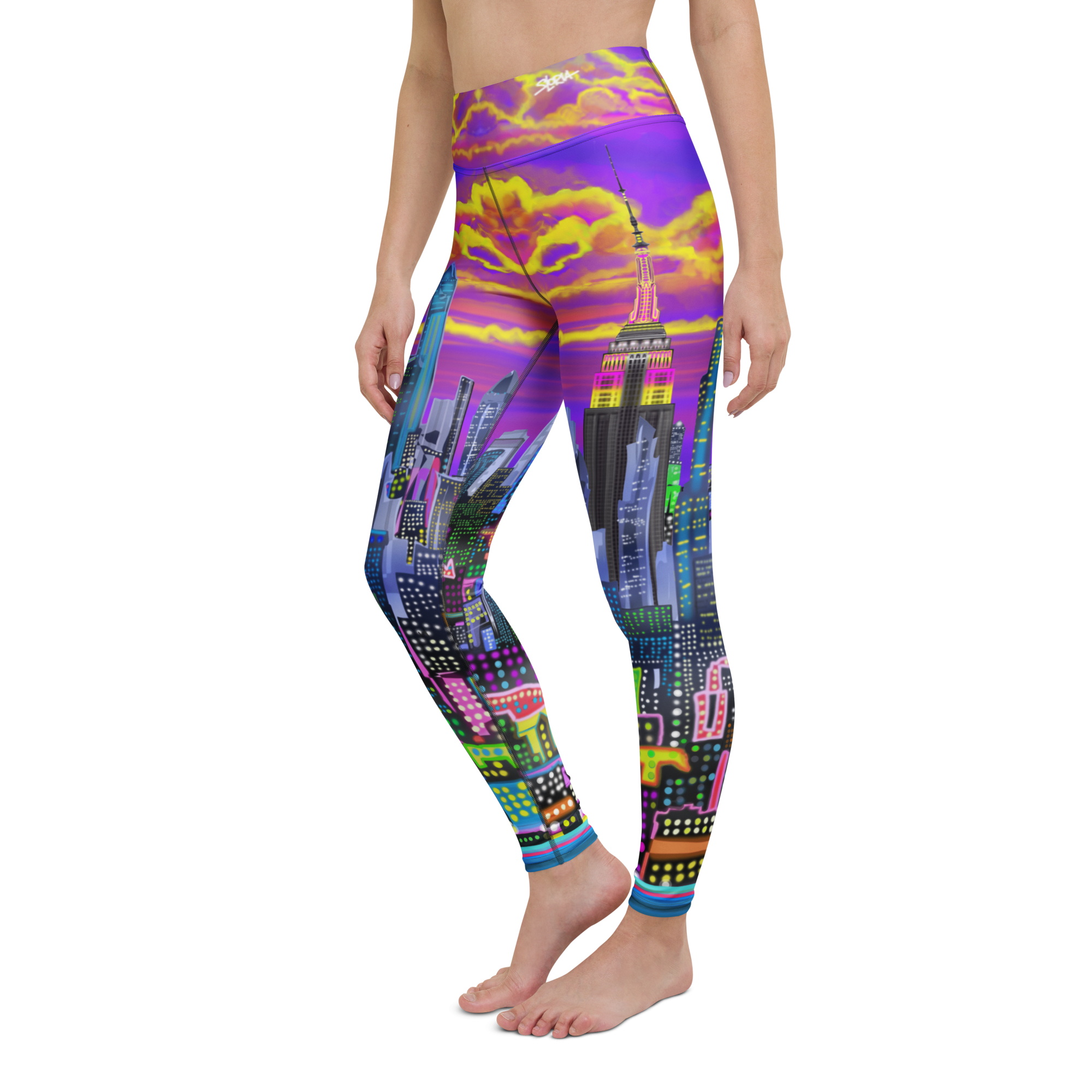 Colorful cityscape Loria NYC Art leggings worn by a person on a white background