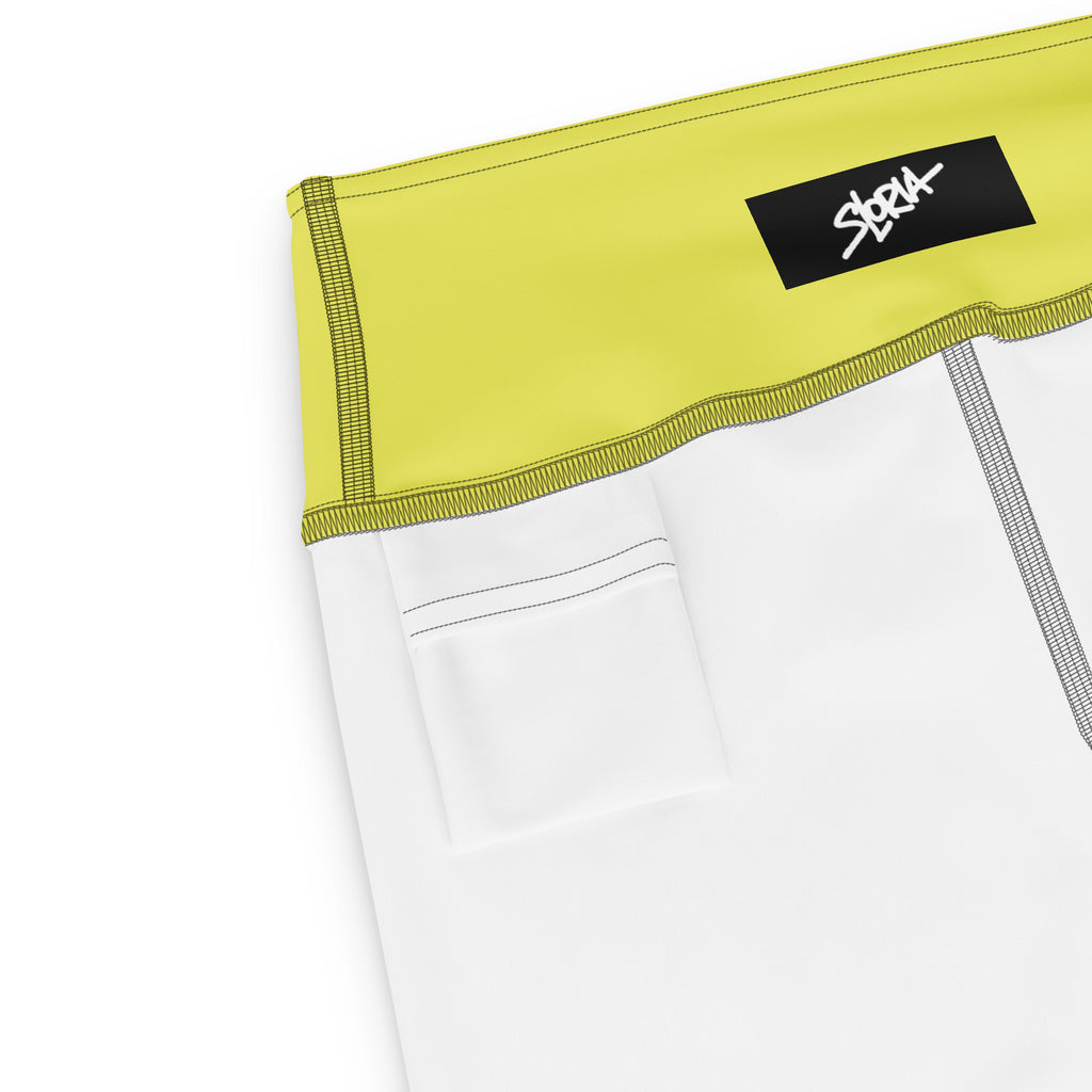 White shorts with a yellow waistband featuring a black logo S.Loria on a white background