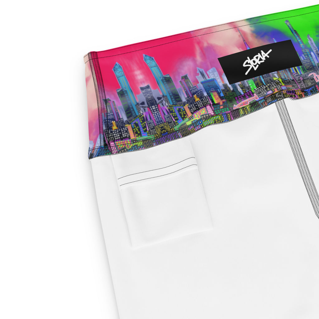 White pants with a colorful cityscape waistband and a brand logo on a white background