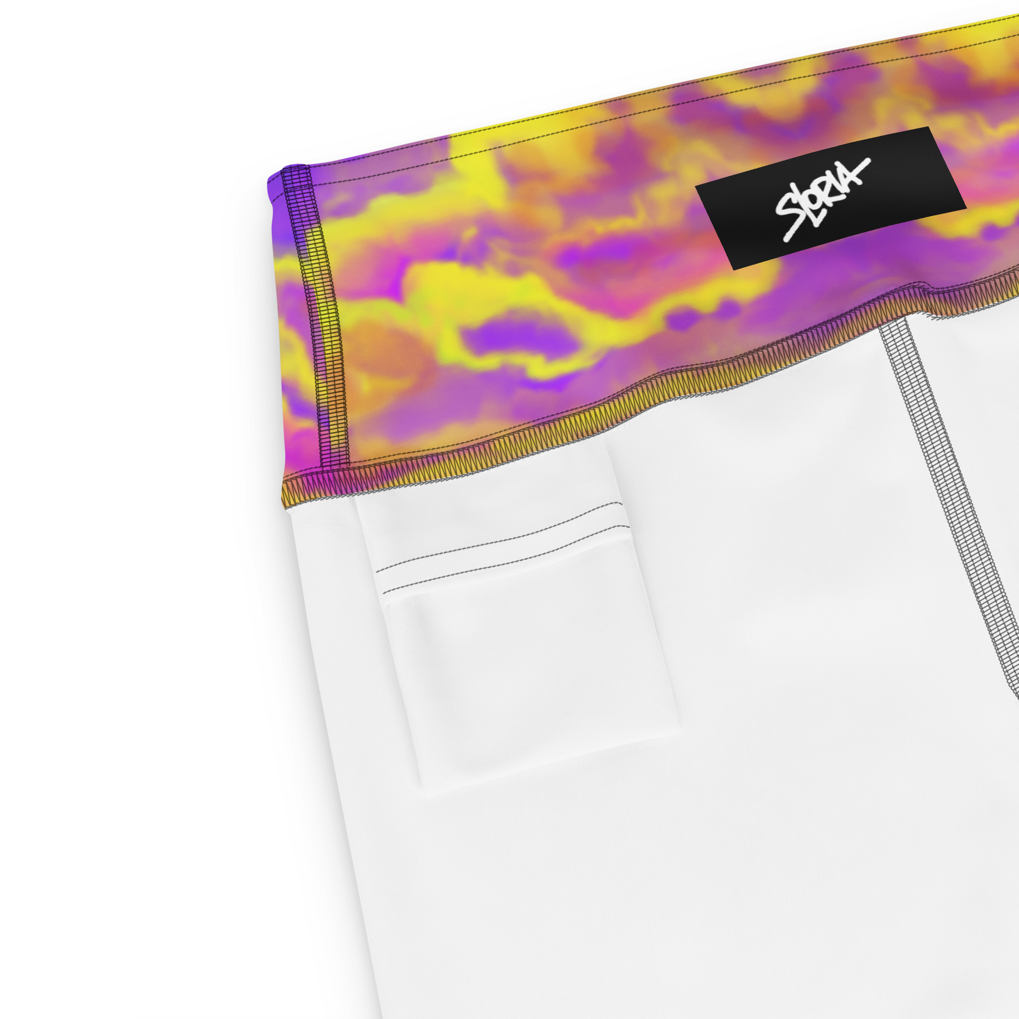 White shorts with a colorful Loria NYC Art waistband and a brand logo on a white background