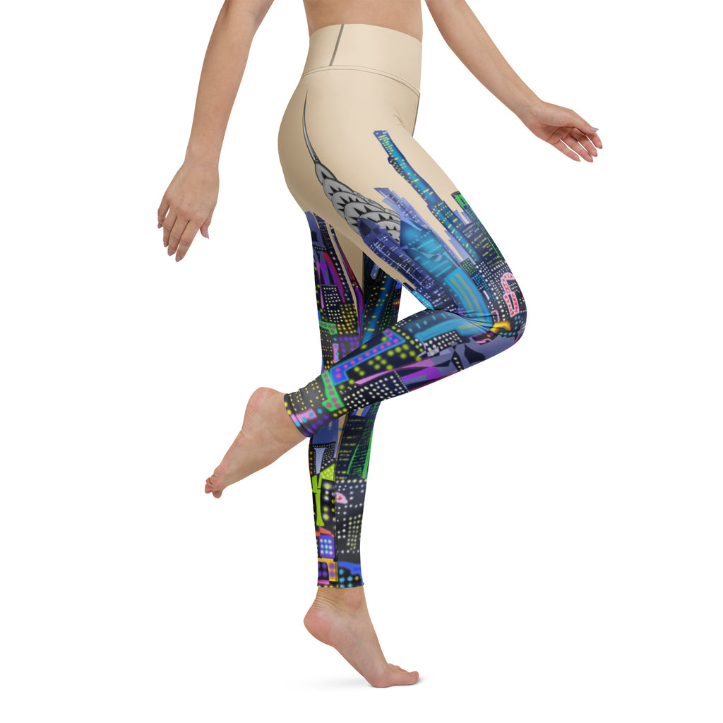 Colorful patterned Loria NYC Art leggings worn by a person on a white background