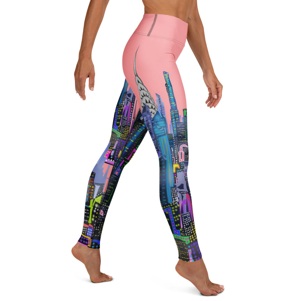 Pink Colorful cityscape Loria NYC Art leggings worn by a person on a white background