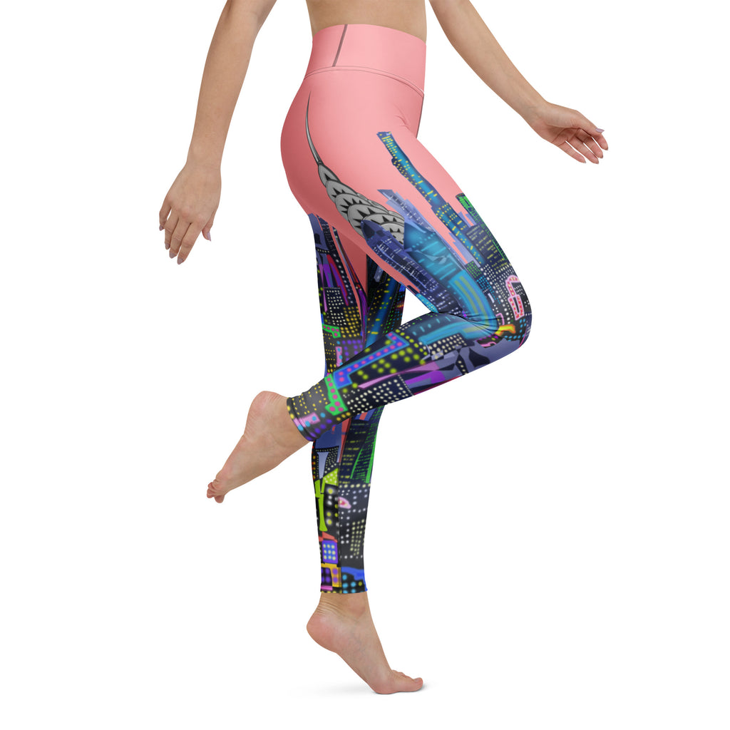 Colorful Loria NYC Art patterned leggings with a pink top worn by a person on a white background