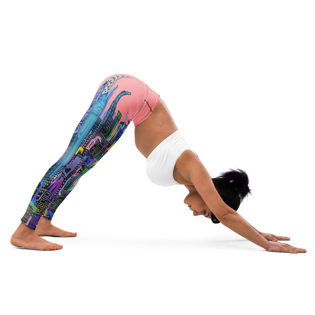 Person wearing Loria NYC Art colorful leggings and a white top, performing a yoga pose on a white background