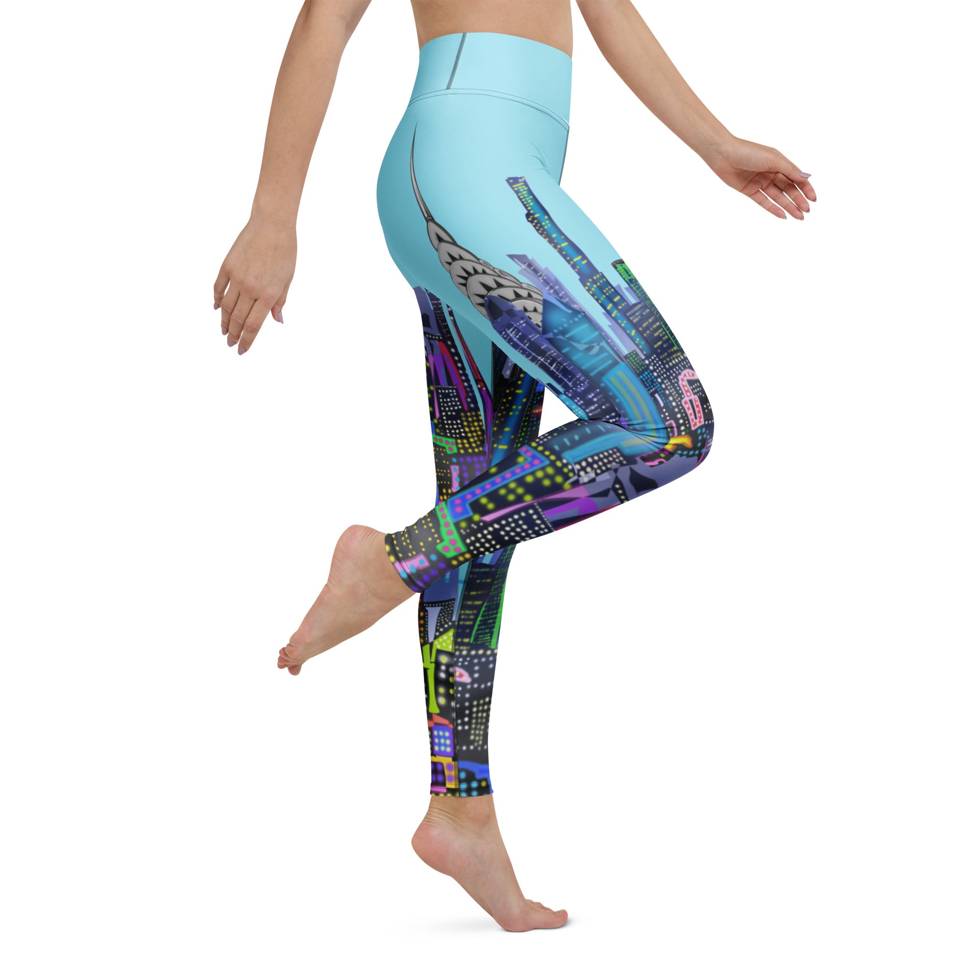 Colorful Loria NYC Art patterned leggings worn by a person on a white background