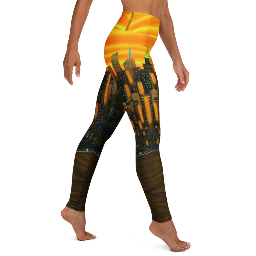 Leggings with an orange Loria NYC Art cityscape design featuring a sunset, worn by a person on a white background.