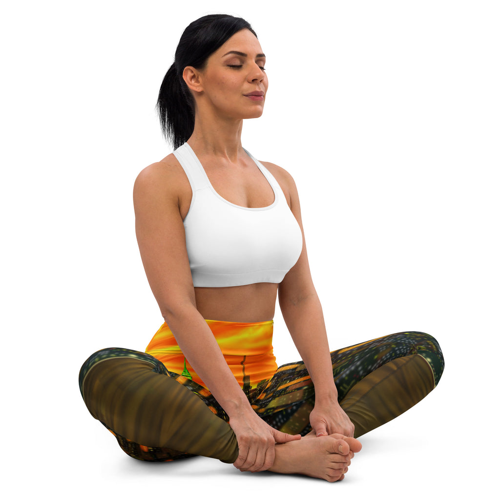 Woman in a yoga pose wearing a white sports bra and patterned orange Loria NYC Art leggings on a white background