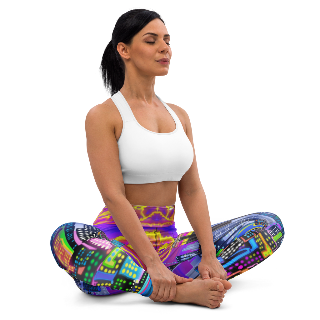 Woman in a white sports bra and Loria NYC Art colorful yoga pants sitting in a yoga pose on a white background
