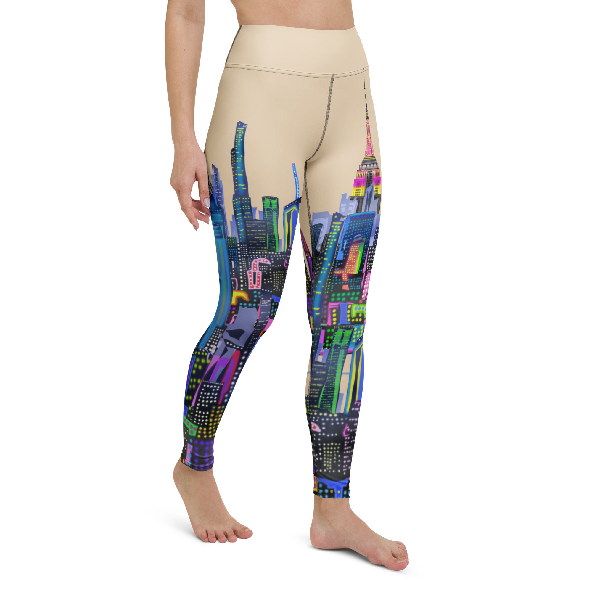 Leggings with a colorful cityscape Loria NYC Art design worn by a person on a white background