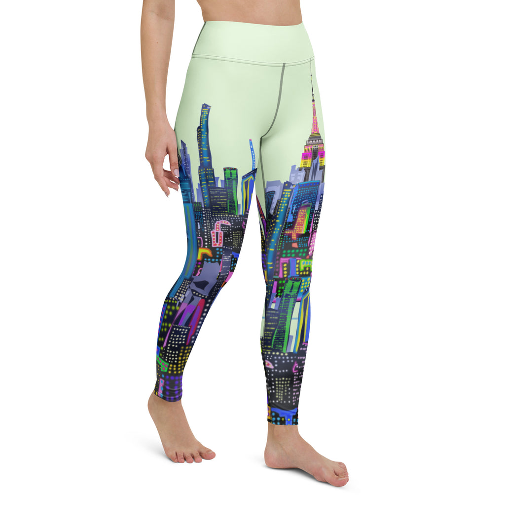 Leggings with a colorful green Loria NYC Art cityscape design on a light green background