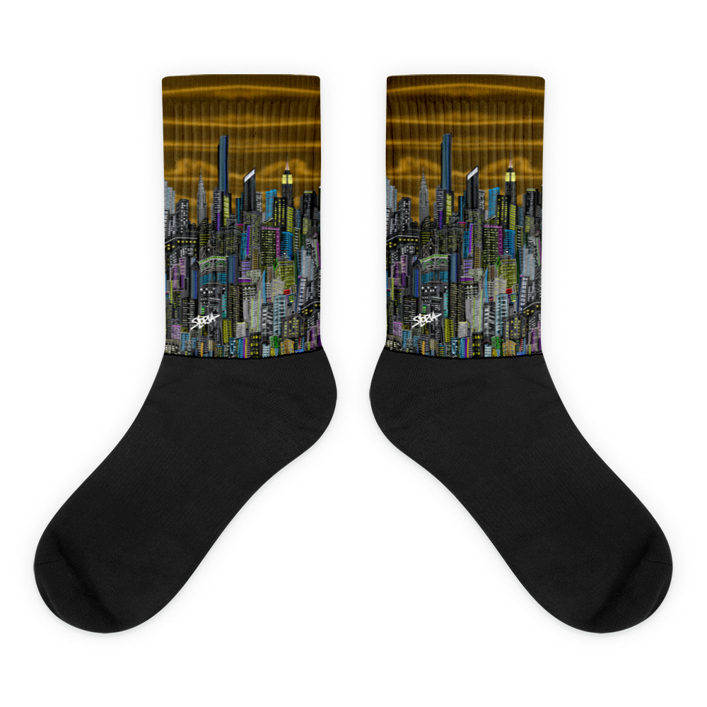 Black socks with a Loria NYC Art cityscape design on a white background
