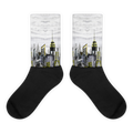 Black Loria NYC Art socks with city skyline design on a white background