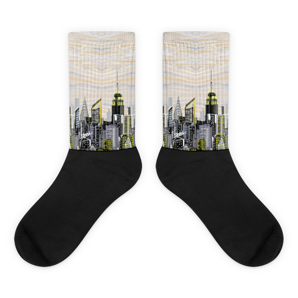 Black beige Loria NYC Art socks with cityscape design on a white background 