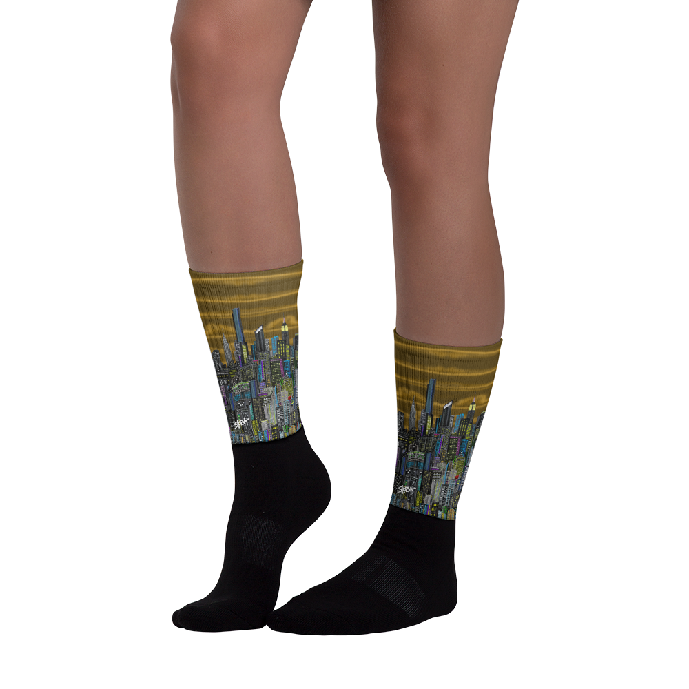 Socks with cityscape Loria NYC Art design worn by a person on a white background