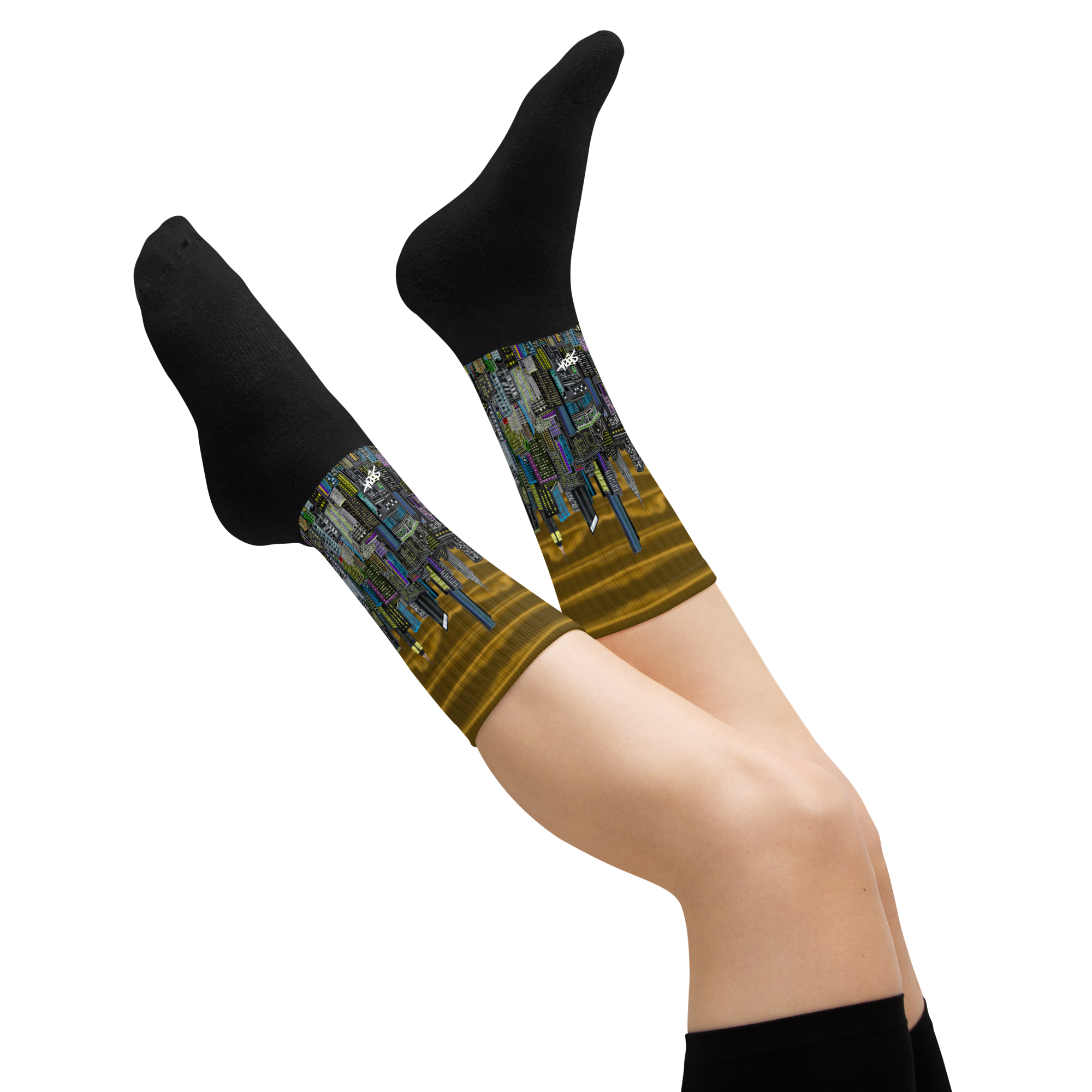 Legs wearing black socks with a Loria NYC Art cityscape design on a white background