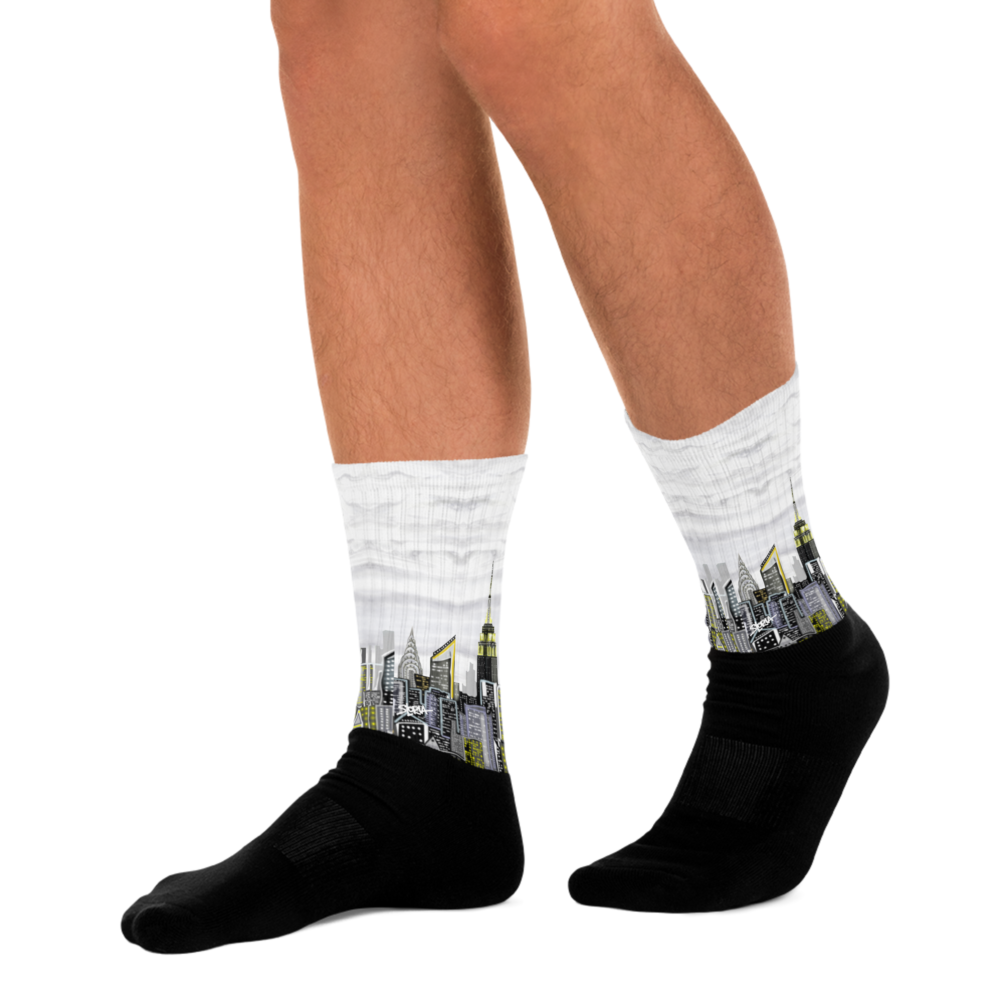 Black Loria NYC Art socks with cityscape design worn by a person on a white background