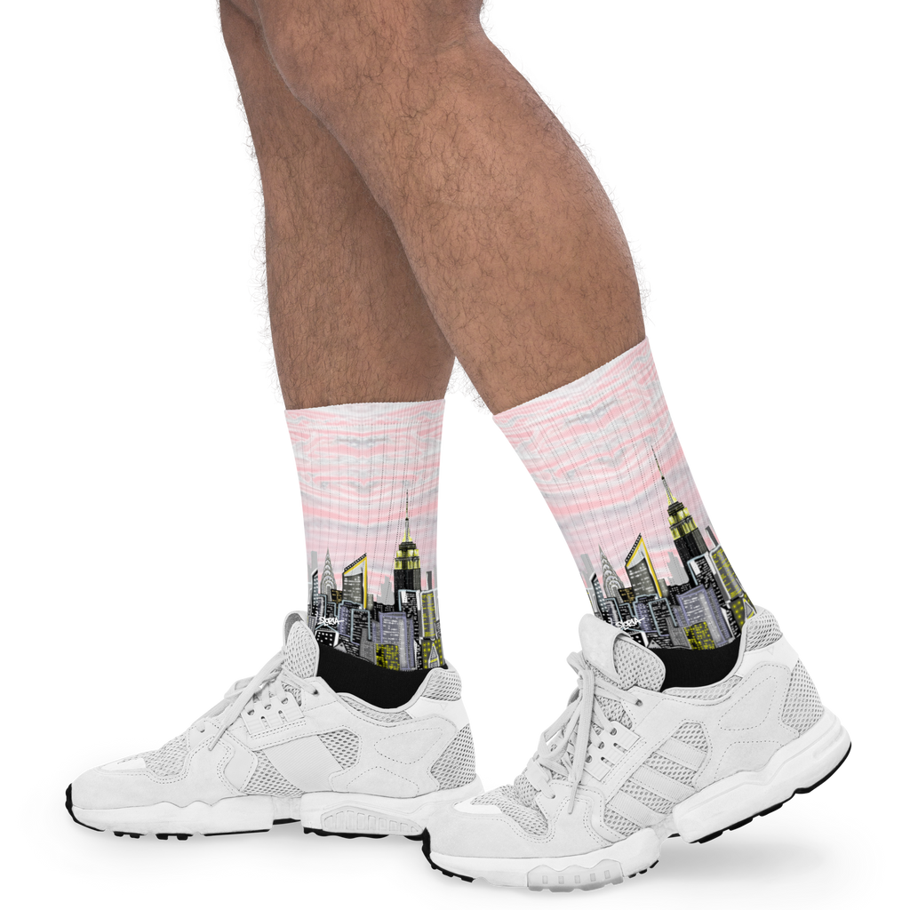 Person wearing white pink socks with cityscape Loria NYC Art design and white sneakers on a white background