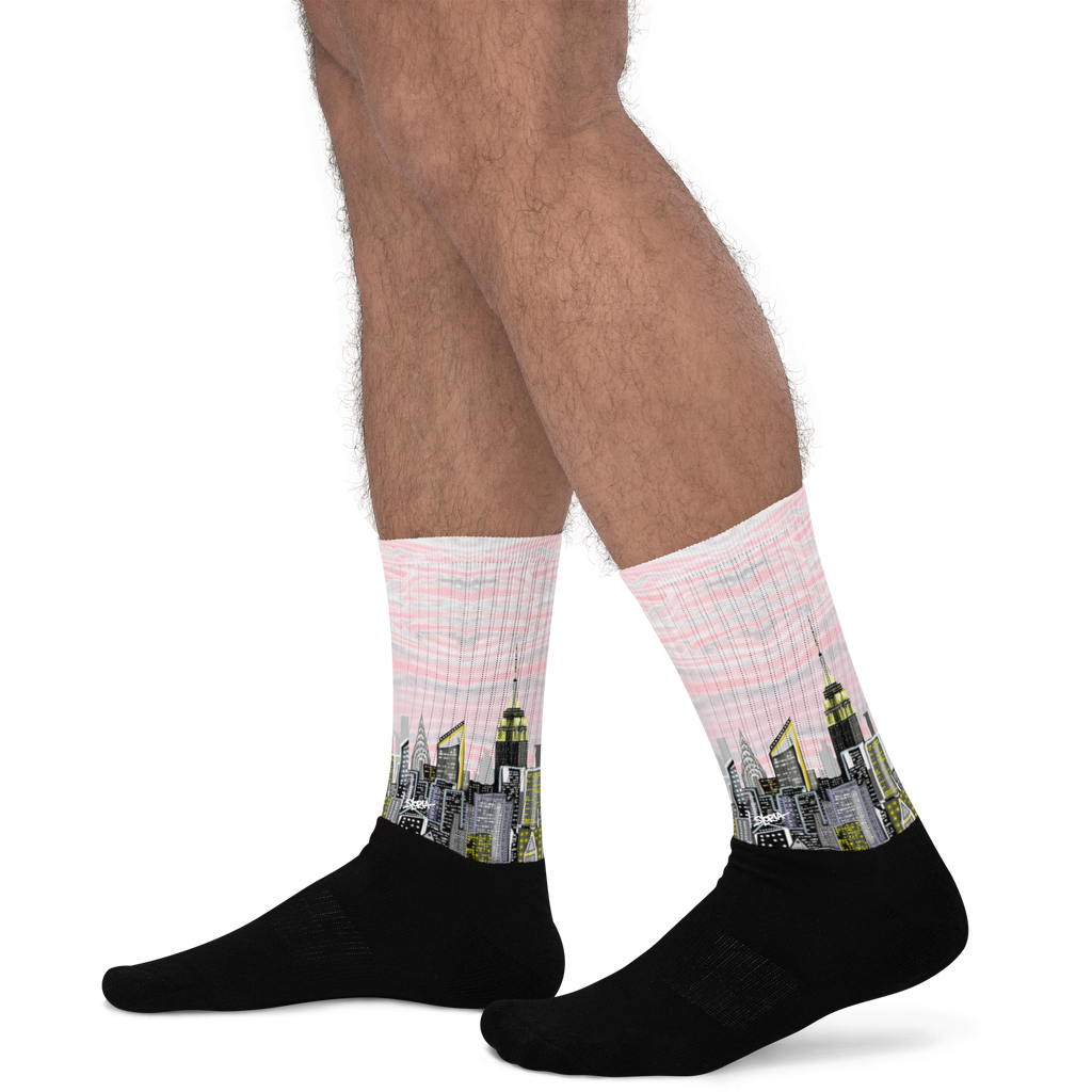 Person wearing socks with Loria NYC Art cityscape design on a white background