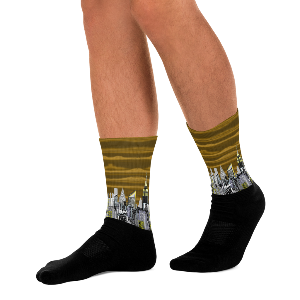 Cityscape Loria NYC Art socks with black socks worn on a white background
