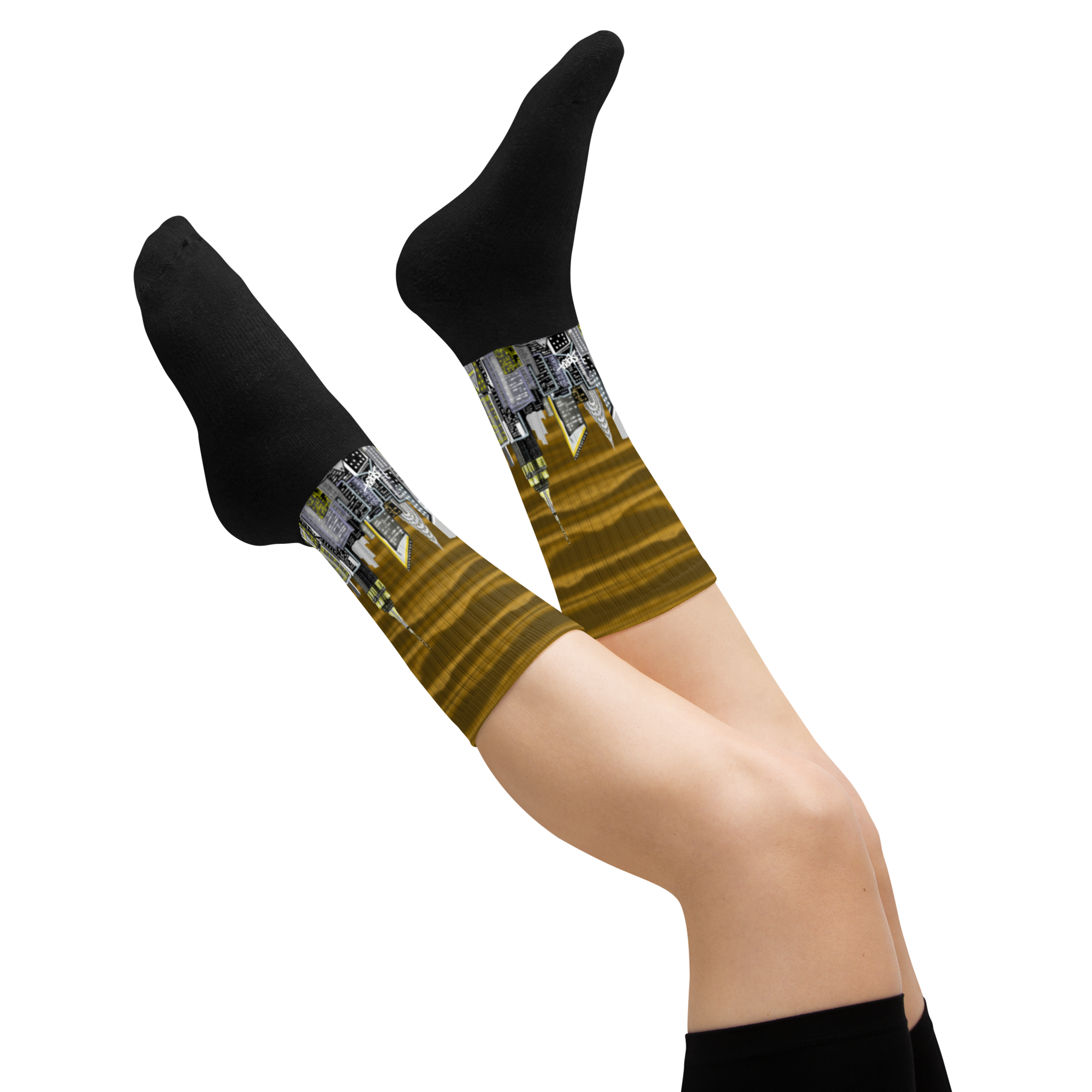 Legs wearing black Loria NYC Art socks with a unique pattern on a white background