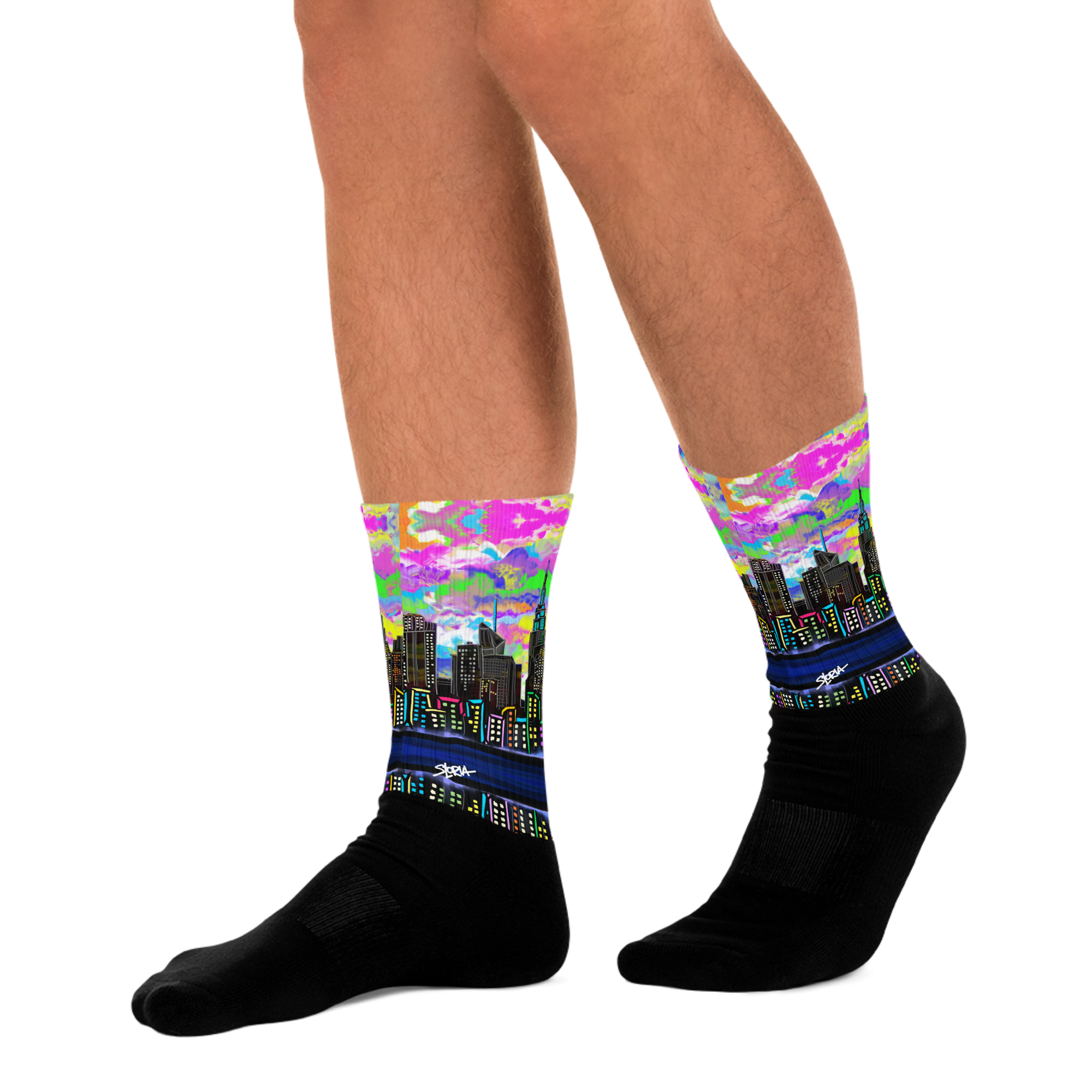 Colorful cityscape Loria NYC Art socks with black soles worn by a person on a white background