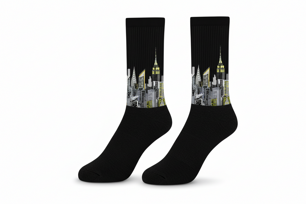 Black Loria NYC Art socks with cityscape design on a light green background